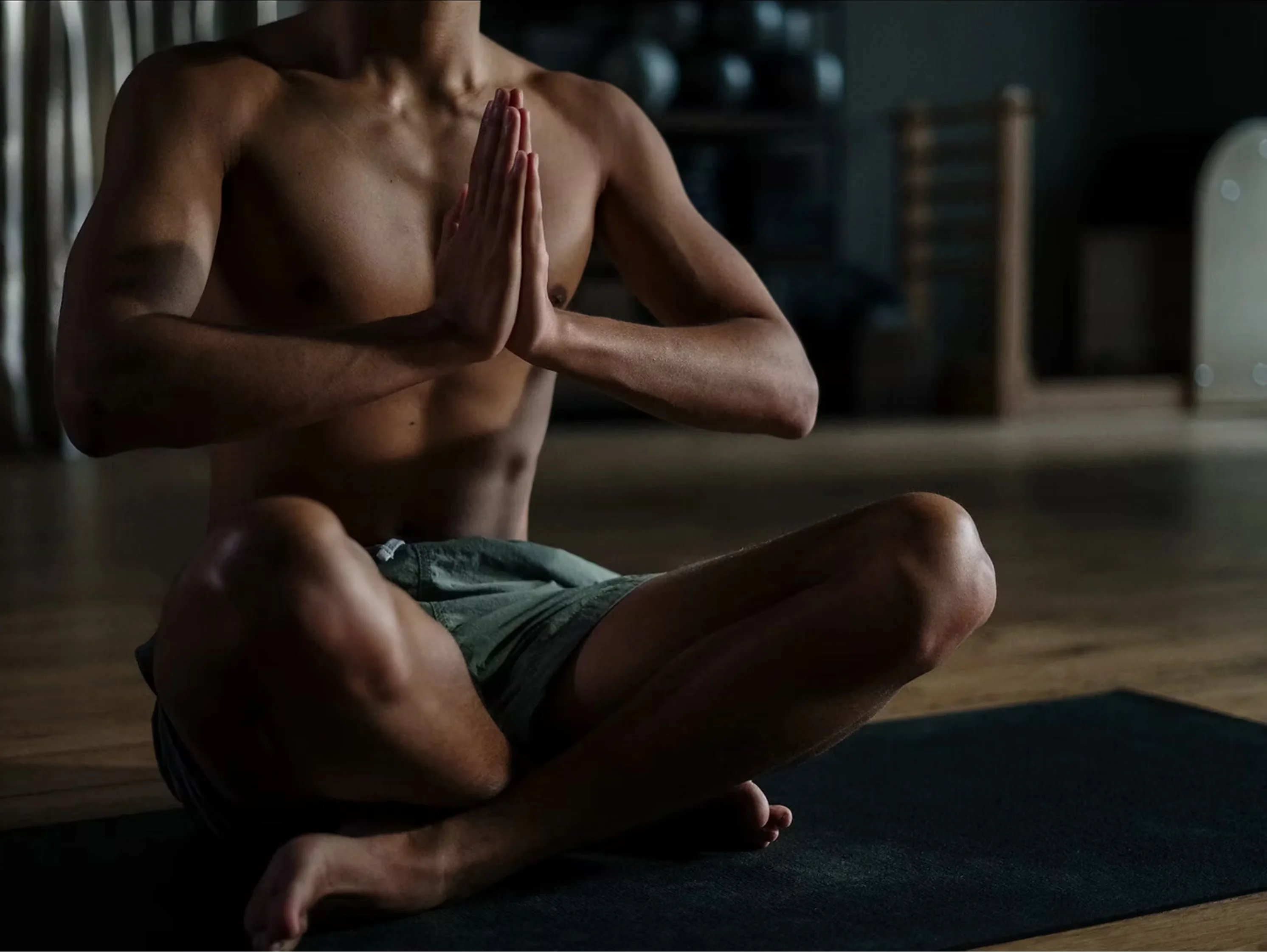 Man meditating in prayer position